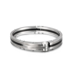 Vintage stainless steel cuff bracelet with black carbon fiber inlay and rivet details