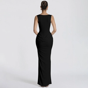 Detail of elegant black bodycon maxi dress featuring ruching and floor-length fishtail hem