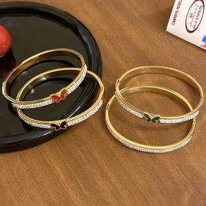 Luxury gold butterfly bangles with sparkling zircon crystals in four vibrant colors