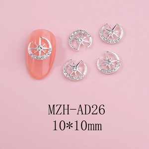 Detailed view of silver star and moon nail art charms with crystal rhinestones