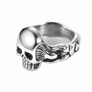 Vintage stainless steel skull ring with antique silver finish shown from a side view