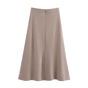 Flat lay of soft beige knitted A-line skirt with elastic waist on white background