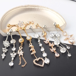 Assorted gold and silver navel button rings with heart, star, and butterfly zircon designs