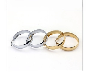 Polished silver and gold chunky hoop earrings in wide flat stainless steel design