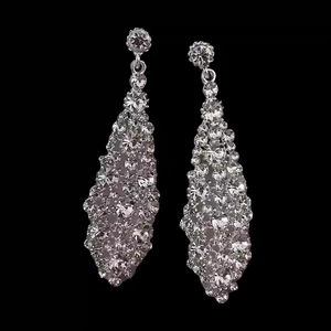 Sparkling silver needle earrings with irregular geometric crystal drop design