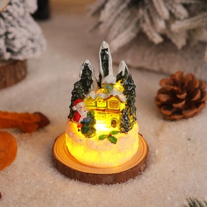 Close-up of a glowing Christmas resin gingerbread house on a rustic wood slice