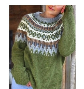 Detail of green Fair Isle knit sweater showing textured wool blend and round neckline
