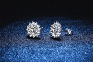 Macro detail of sun flower silver stud earrings with sparkling round moissanite