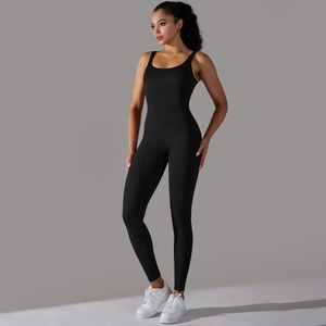Detail of black ribbed seamless jumpsuit showing high-stretch fabric and slim fit design