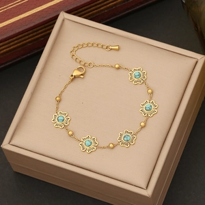 Retro stainless steel bracelet with turquoise flower charms in a gift jewelry box