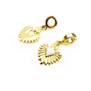 Detail of golden heart charms with white enamel inlay and textured metal back