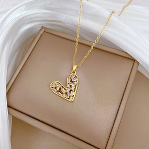 Luxurious hollow heart pendant necklace with shimmering crystals on gold chain