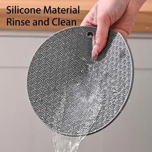 Dark gray round silicone heat resistant mat with wave pattern and easy clean feature