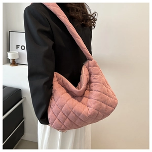 Side view of pink quilted corduroy tote bag showing large capacity and shoulder fit