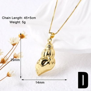 Close-up of 18k gold plated conch shell pendant necklace with size dimensions displayed