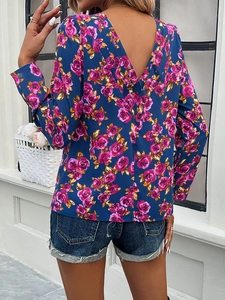 Detail of V-neck back design on long sleeve floral top with pink and gold roses