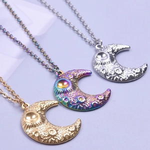 Rainbow and gold lunar surface moon pendant necklaces with textured crater detailing