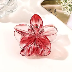 Detailed view of pink gradient flower hair claw clip with transparent acrylic texture