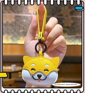 Detail of Shiba Inu leather keychain with fine stitching and black metal ring holder