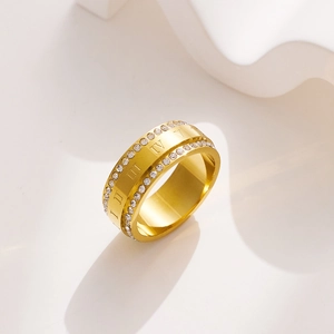 Detail view of gold titanium ring with double-row crystals and Roman numerals