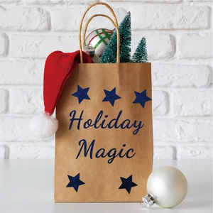 Close-up of brown kraft paper gift bag with blue glitter stars and Holiday Magic text