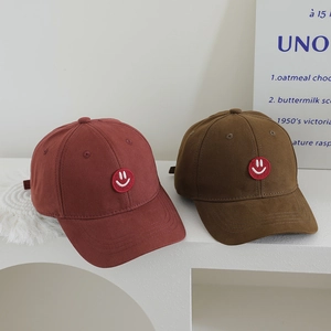 Classic cotton baseball caps for kids with red smiley face embroidery in brown and maroon