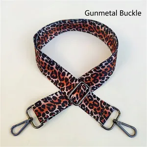 Detailed view of leopard print bag strap with adjustable gunmetal lobster clasps