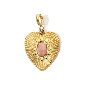 Macro detail of heart-shaped gold titanium steel pendant with central pink natural stone