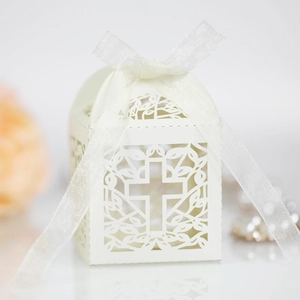 Laser-cut white gift box with cross pattern and ribbon for weddings or christenings