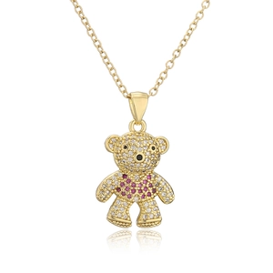 Golden teddy bear pendant necklace with white cubic zirconia and pink heart gem detail