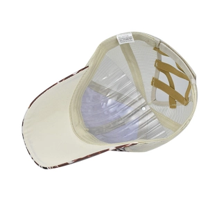 Detail view of the criss-cross elastic ponytail straps and cotton-polyester label