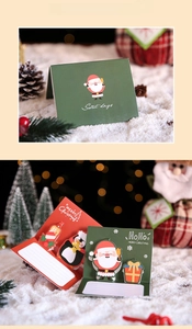 Detailed 3D pop-up Christmas cards featuring Santa, penguins, and holiday gift boxes
