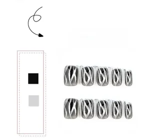 Detail of black gradient press-on nails with silver glitter abstract flame patterns