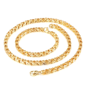 Gold stainless steel jewelry set featuring floral chain links with a secure lobster clasp
