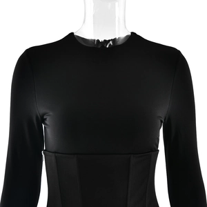 Detail view of black high-stretch bodycon dress featuring waist cinching and side zipper