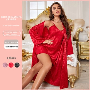 Detail of red faux silk pajama set with subtle leopard jacquard texture and silky finish