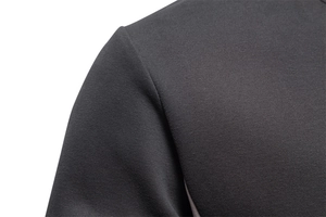 Close-up of shoulder seams and fine knit texture on dark grey long sleeve sweatshirt