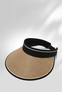 Detail of straw texture and black fabric rim on an open-top wide-brim sun hat