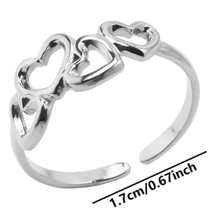 Detail shot of silver adjustable heart ring with inner diameter measurement of 1.7cm