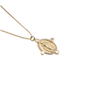 Gold plated necklace with oval Virgin Mary pendant and zircon stones on white background