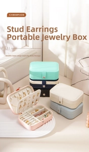 Portable travel jewelry box with double-layer storage for rings, earrings and necklaces.