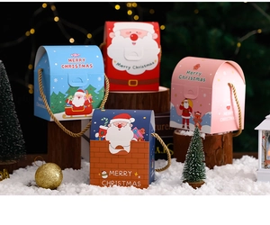 Detail of Christmas gift boxes with Santa patterns and woven handles in cozy holiday setting