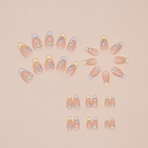 French almond fake nails featuring blueberry patterns and pastel yellow purple tips