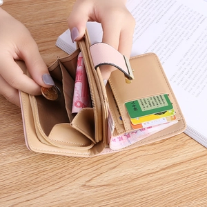 Women's pink bifold wallet with leaf hollow design and multiple card slots