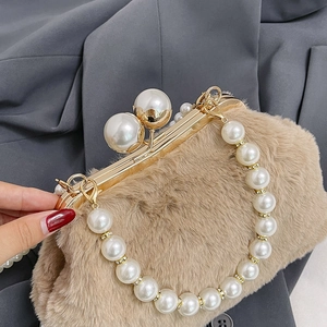Chic faux fur shell bag with large pearl clasp and elegant pearl handle strap