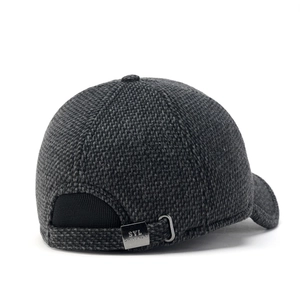 Detail of adjustable metal buckle and dark grey knit texture on winter baseball cap