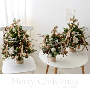 Mini champagne-toned Nordic Christmas tree with LED lights and plush balls on wood base