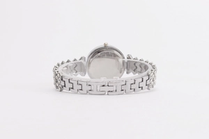 Macro shot of silver ladies watch H-link bracelet with sparkling rhinestone accents