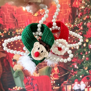 Knitted Christmas pet scarves with reindeer and Santa patterns on pearl hangers