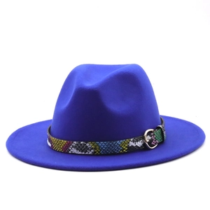 Detail of royal blue fedora hat featuring colorful snakeskin band and gold metal buckle